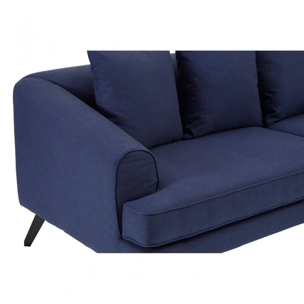 Navy blue fabric sofa with three seat cushions and wide armrest, close side view
