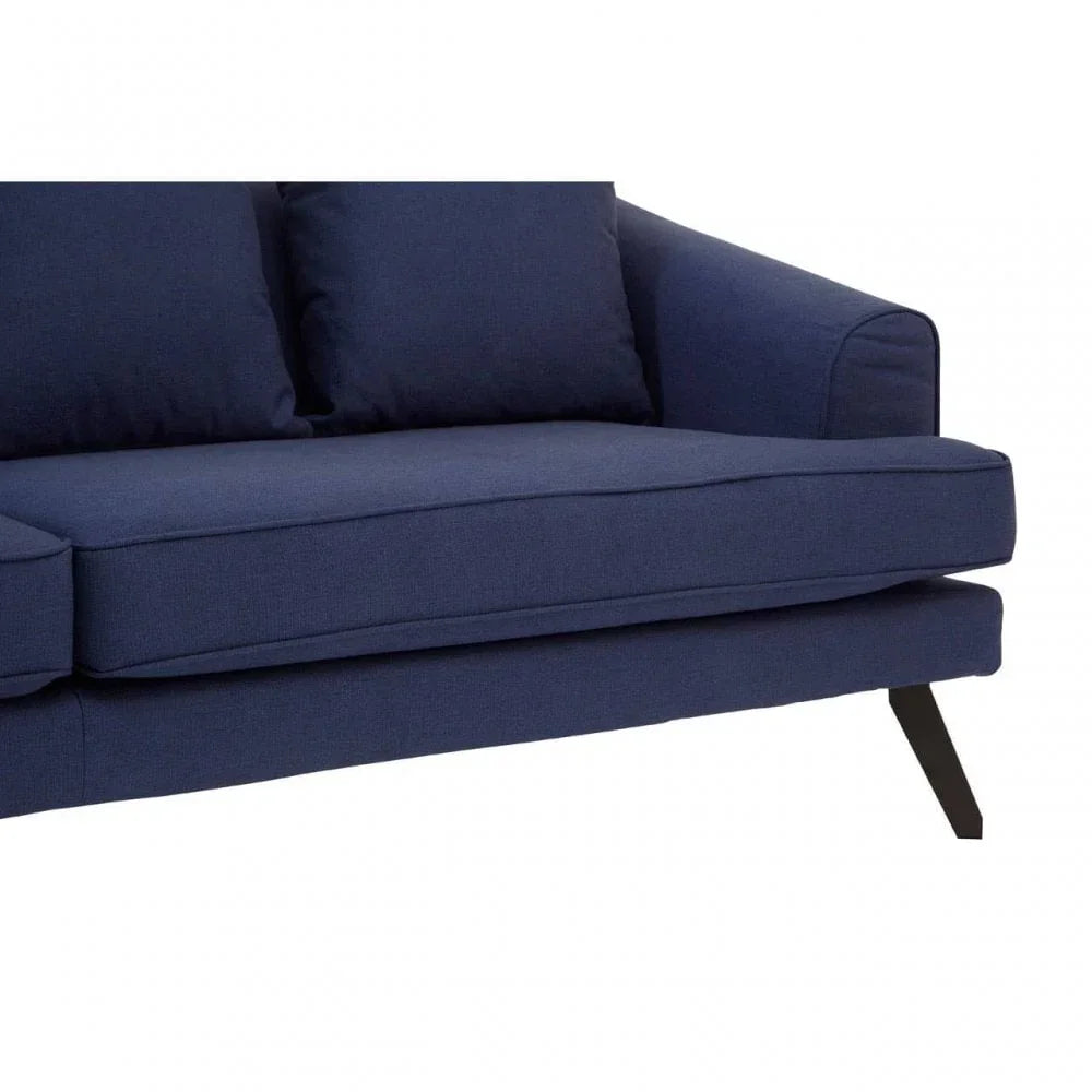 Navy fabric sofa with angled black metal legs and plush back cushions, close-up side view