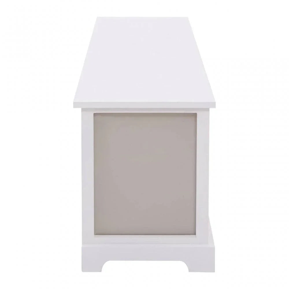 Side view of white wooden bench with panel design and footed base
