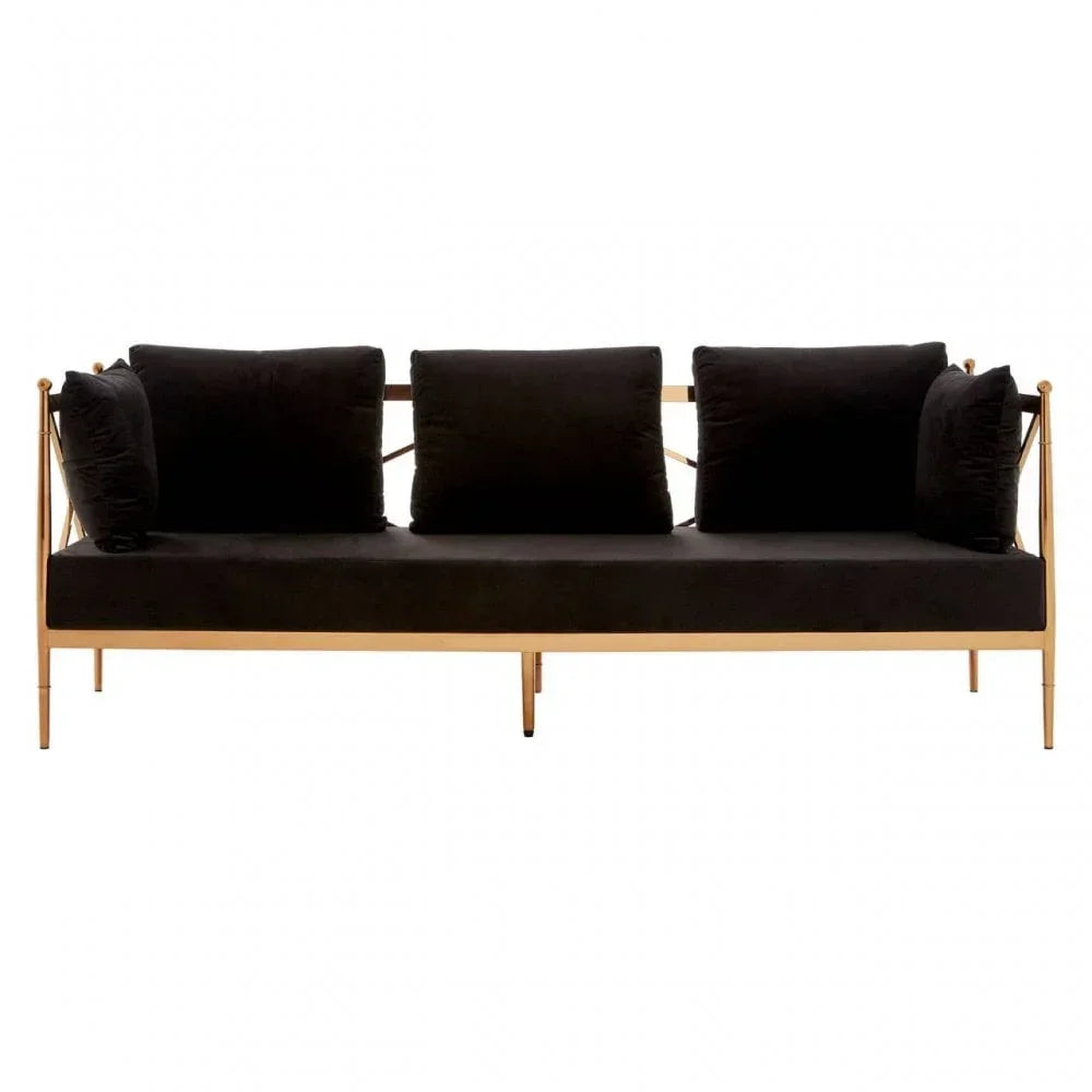 Black velvet sofa with gold metal frame and four cushions, front view