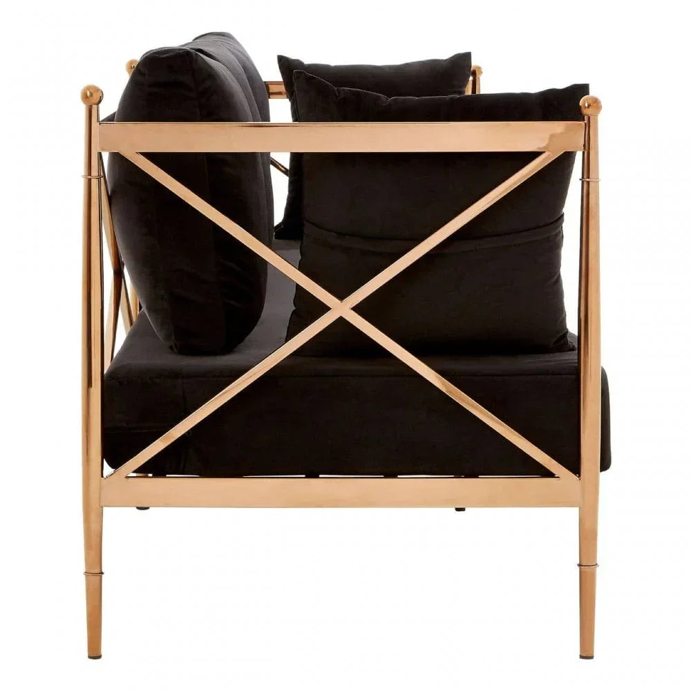 Side view of black sofa with gold metal frame and cross-back design