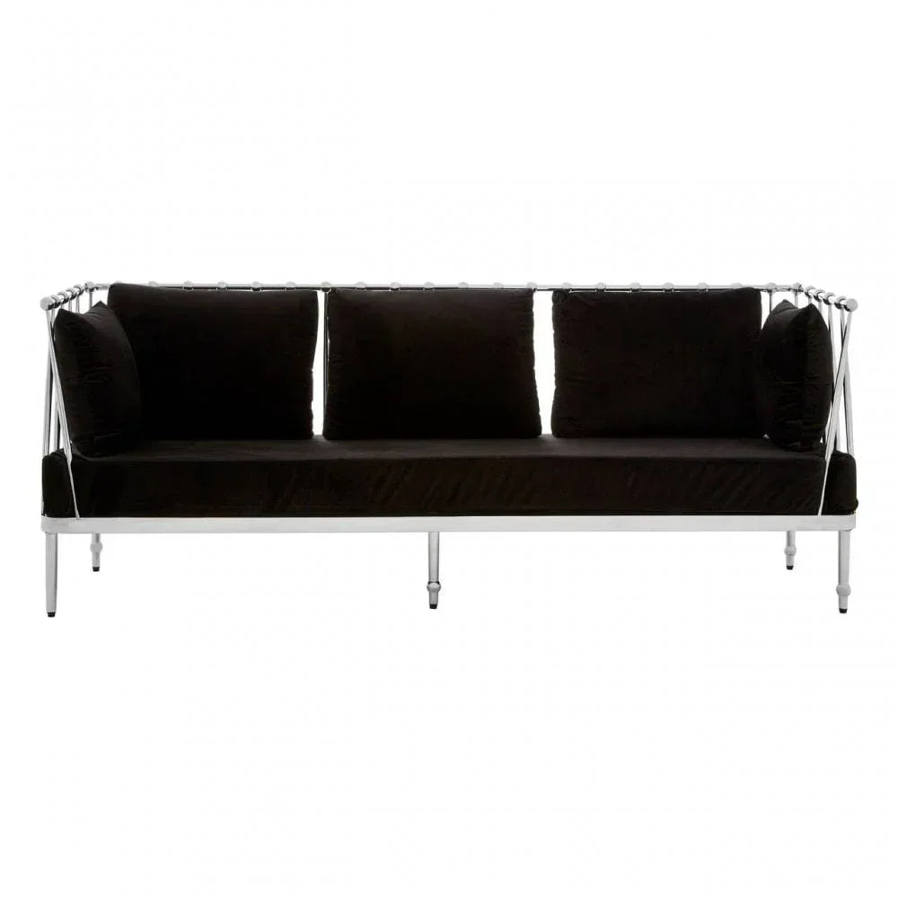 Black velvet sofa with silver metal frame and legs, three seat cushions and armrest pillows