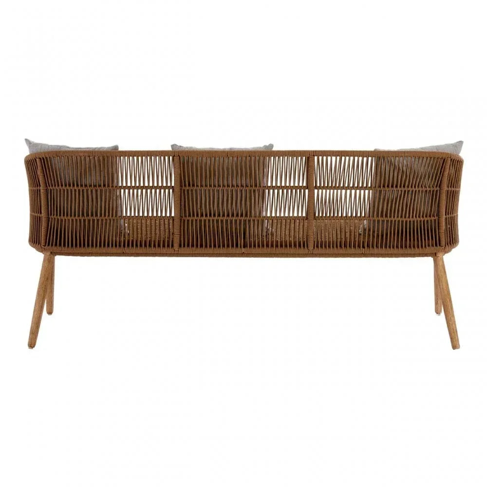 Back view of woven rattan sofa with natural wood legs and grey cushions