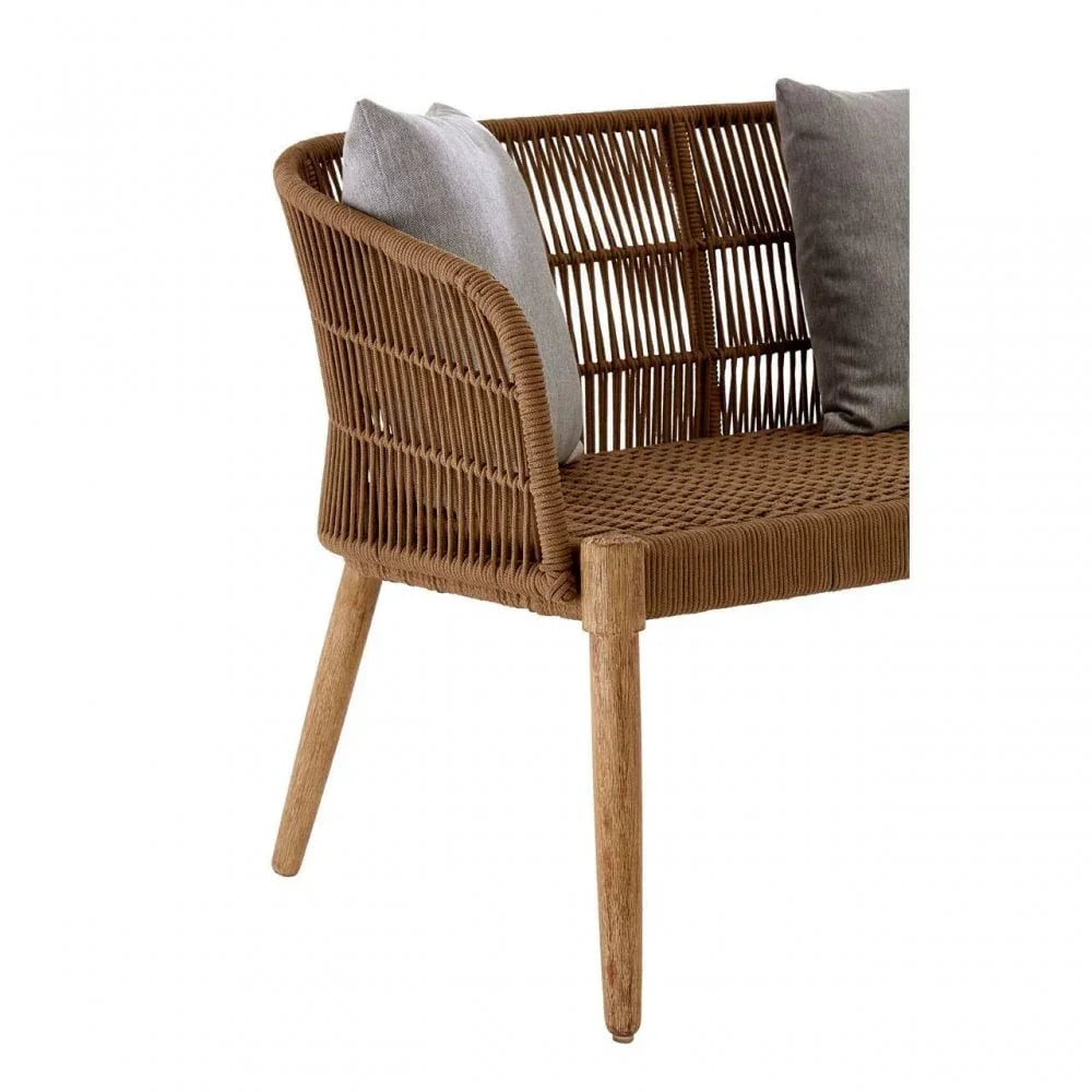 Brown rattan bench with wooden legs and grey cushions, partial side view