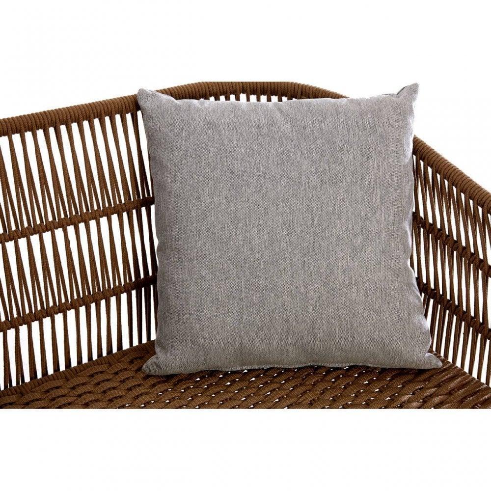 Grey cushion on brown rattan garden furniture with woven armrest detail