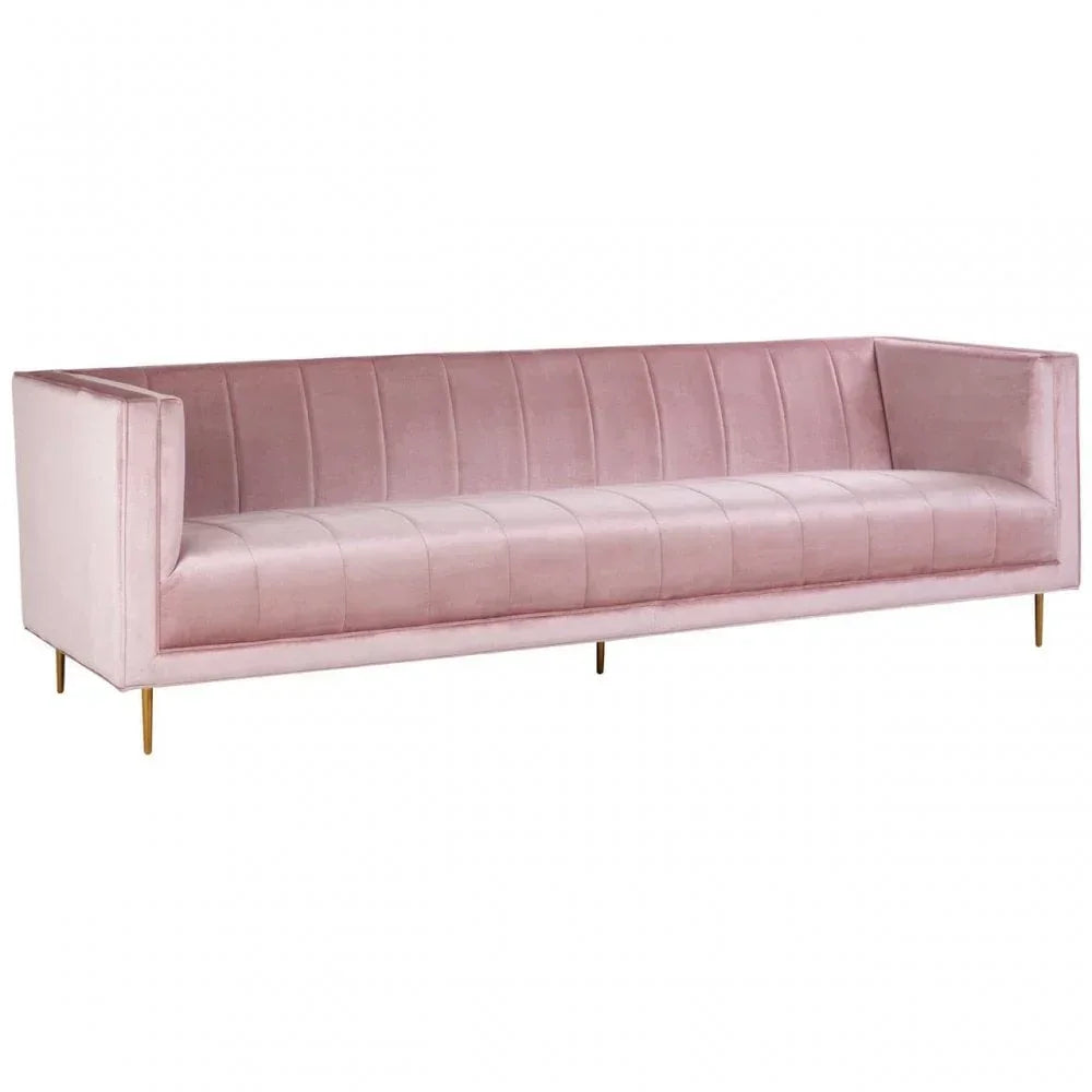Blush pink velvet sofa with vertical channel tufting and slim gold metal legs