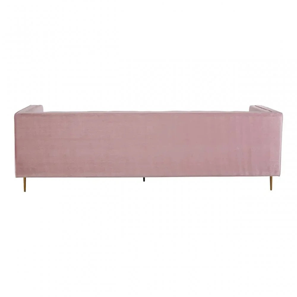 Back view of pink velvet sofa with gold legs on white background