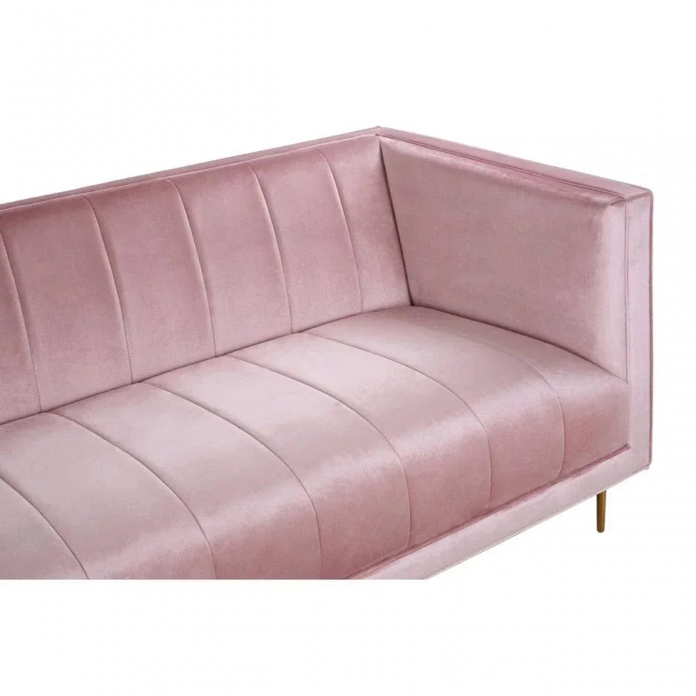 Blush pink velvet sofa with vertical stitched upholstery and gold metal legs