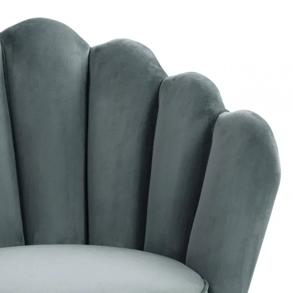 Grey velvet scalloped accent chair back and seat closeup