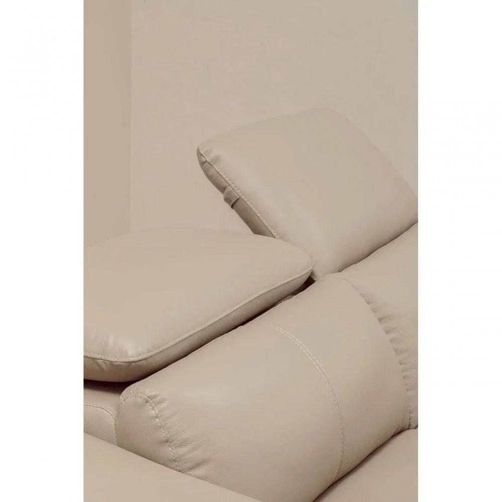 Close up of beige leather sofa adjustable headrests