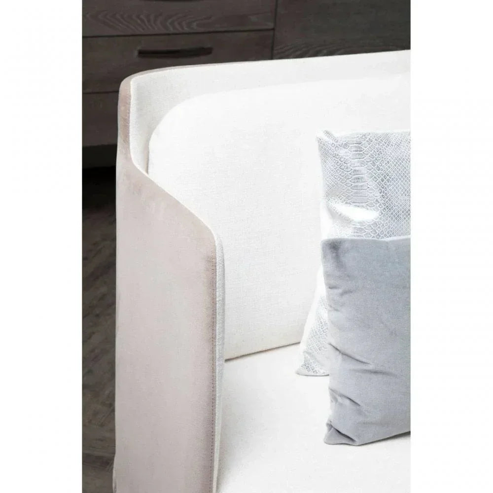Light grey fabric sofa arm detail with grey and white textured cushions