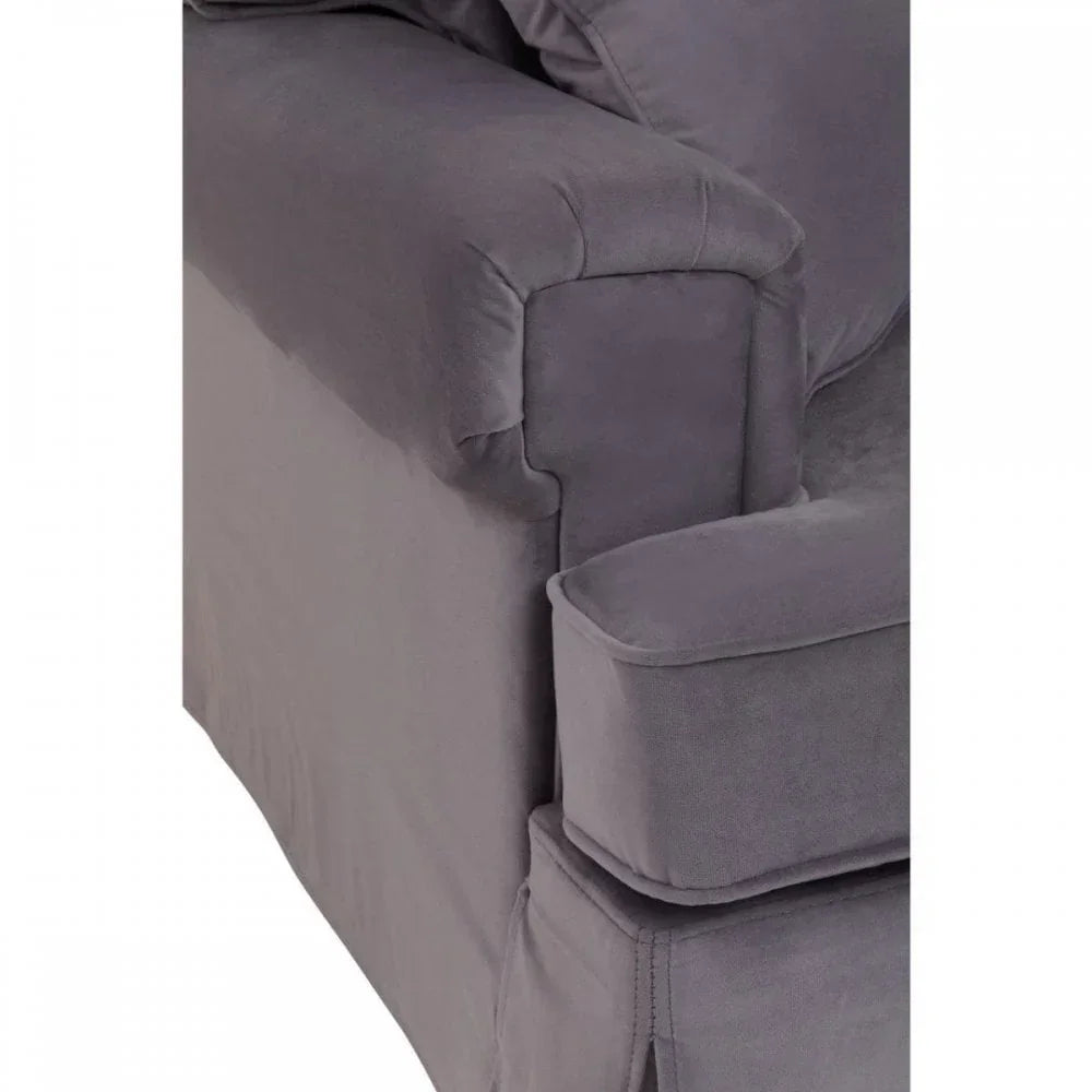Closeup of grey fabric corner sofa arm with matching cushions and smooth upholstery