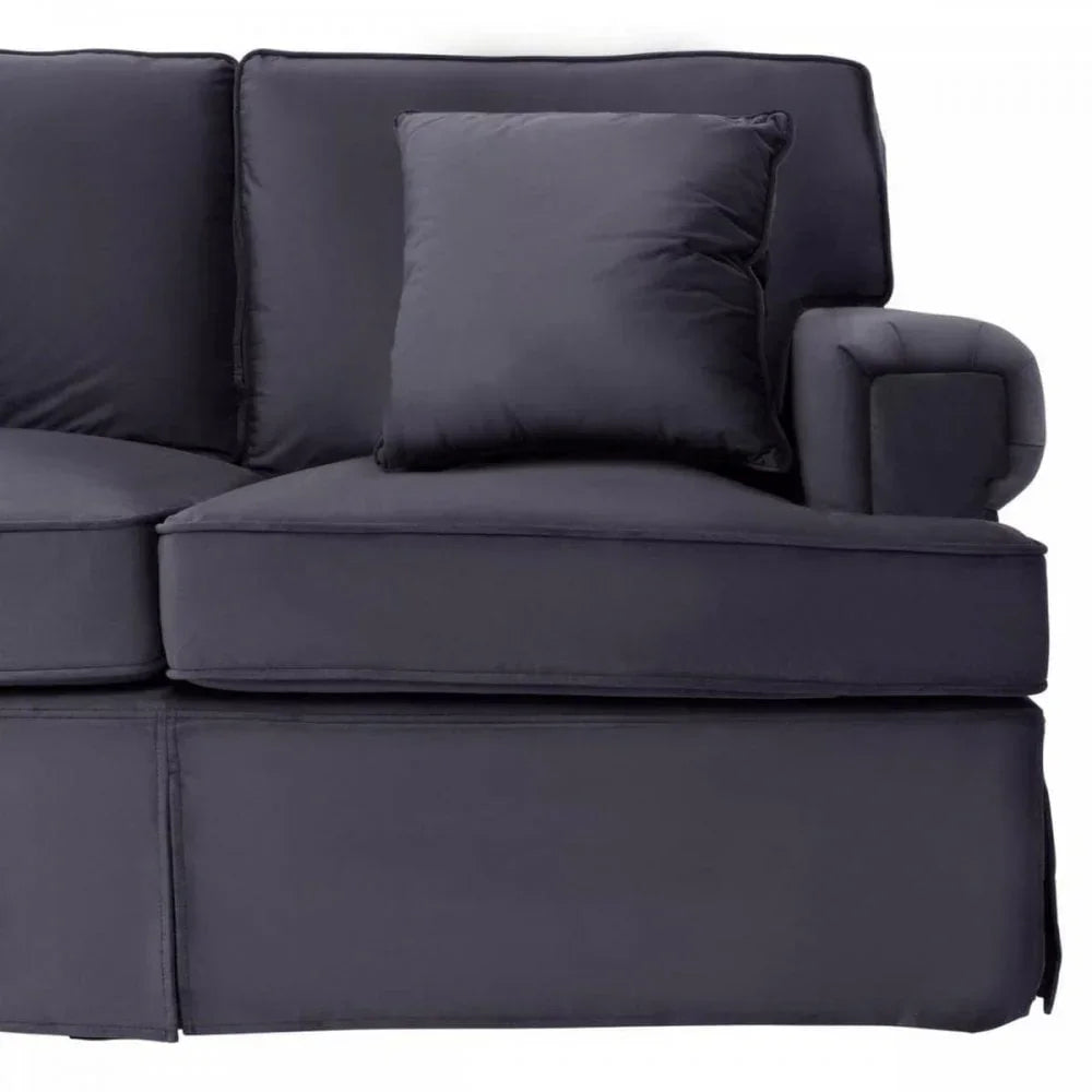 Dark grey fabric sofa with matching square cushion and armrest, close-up front view