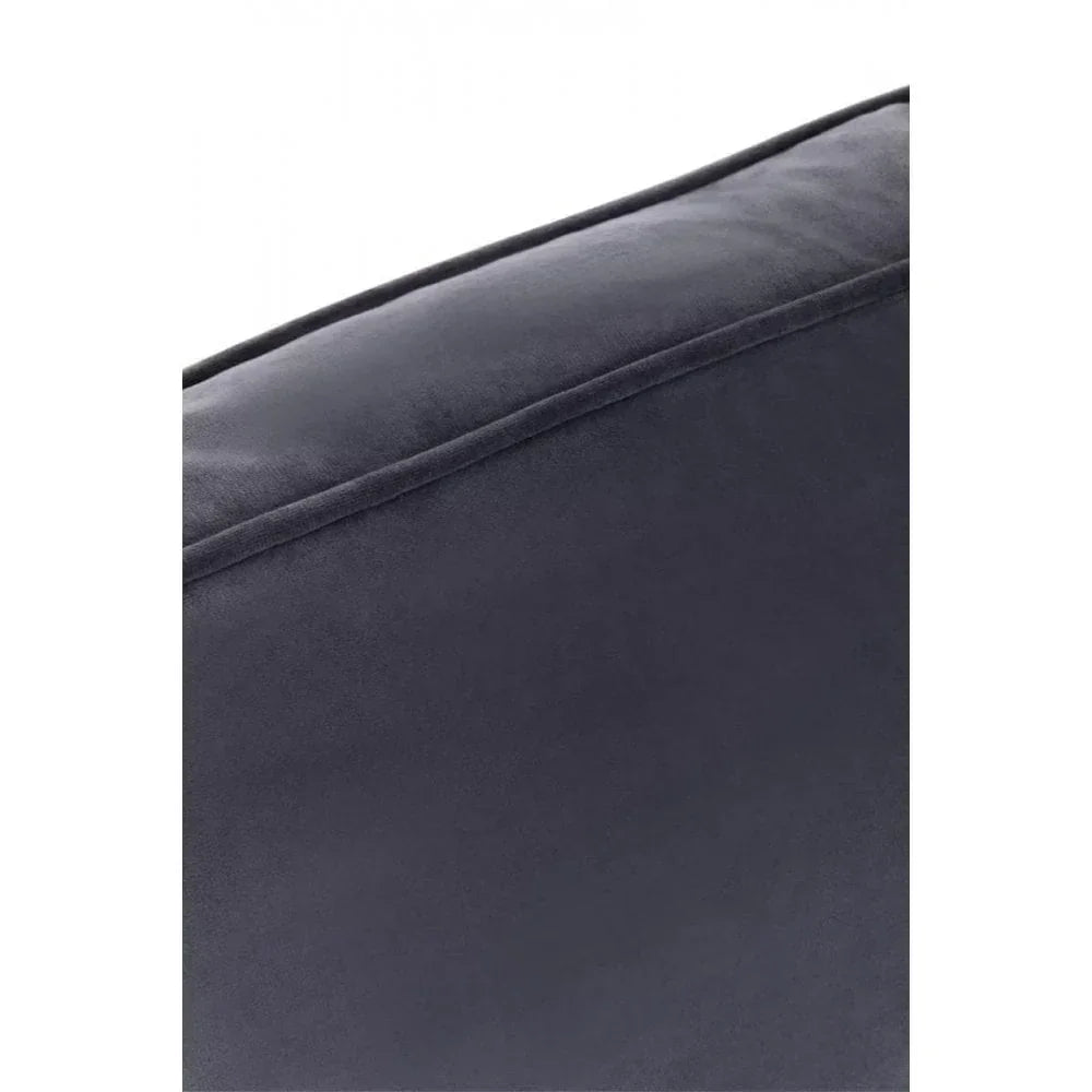 Closeup of dark grey velvet sofa cushion with piped edge detailing
