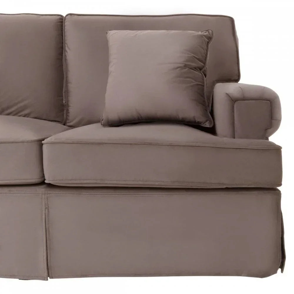 Taupe fabric sofa with armrest and matching cushion, close-up of seat and backrest
