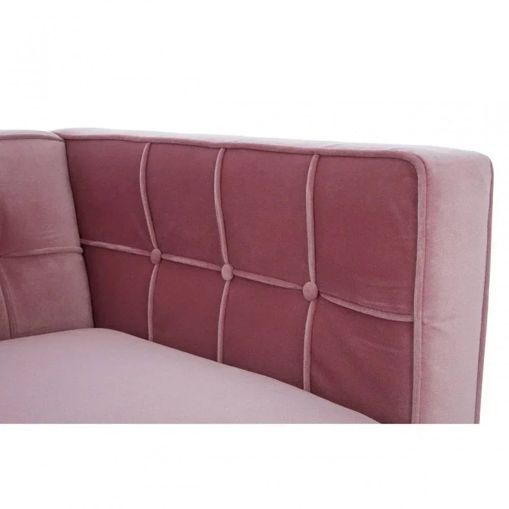 Blush pink velvet sofa corner with tufted backrest and piping detail