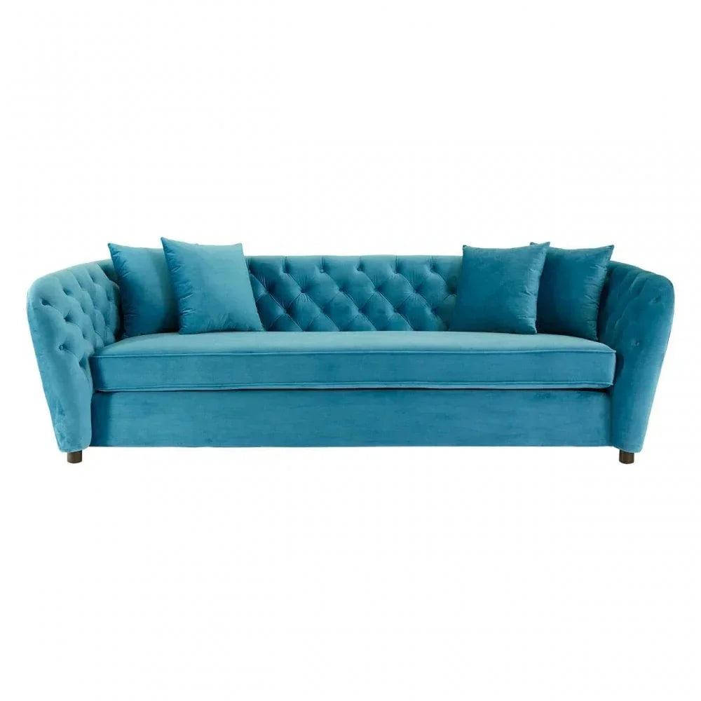 Teal velvet sofa with tufted backrest and four matching scatter cushions, front view