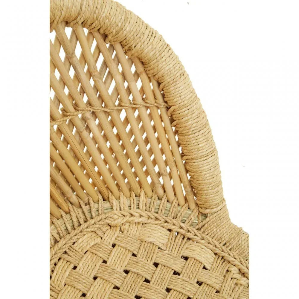 Close view of woven rattan chair backrest with natural finish and textured detailing
