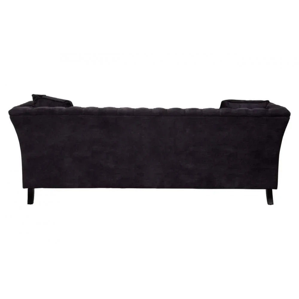 Back view of black fabric sofa with curved arms and raised legs