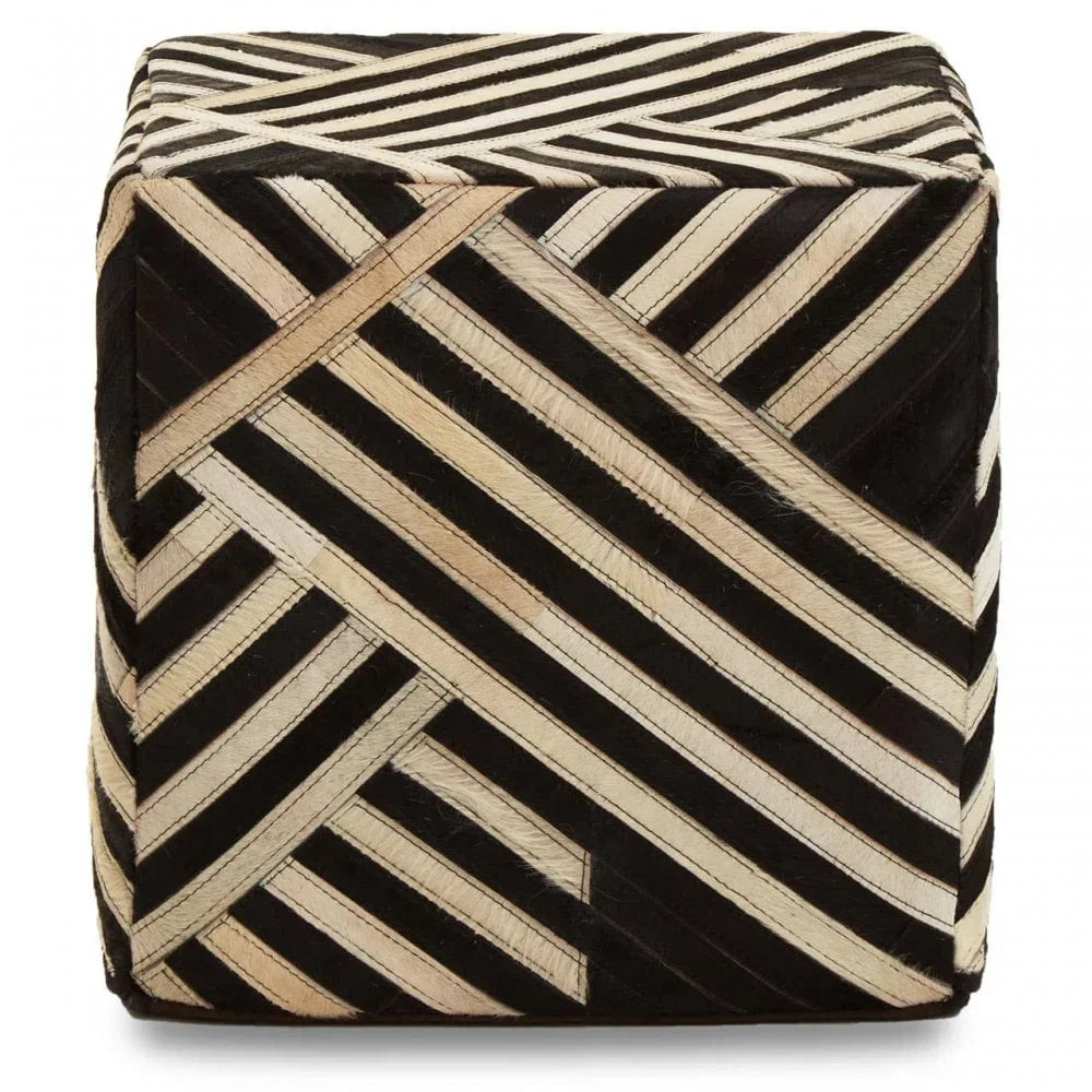 Geometric cube pouffe with black and cream striped pattern, upholstered in textured fabric