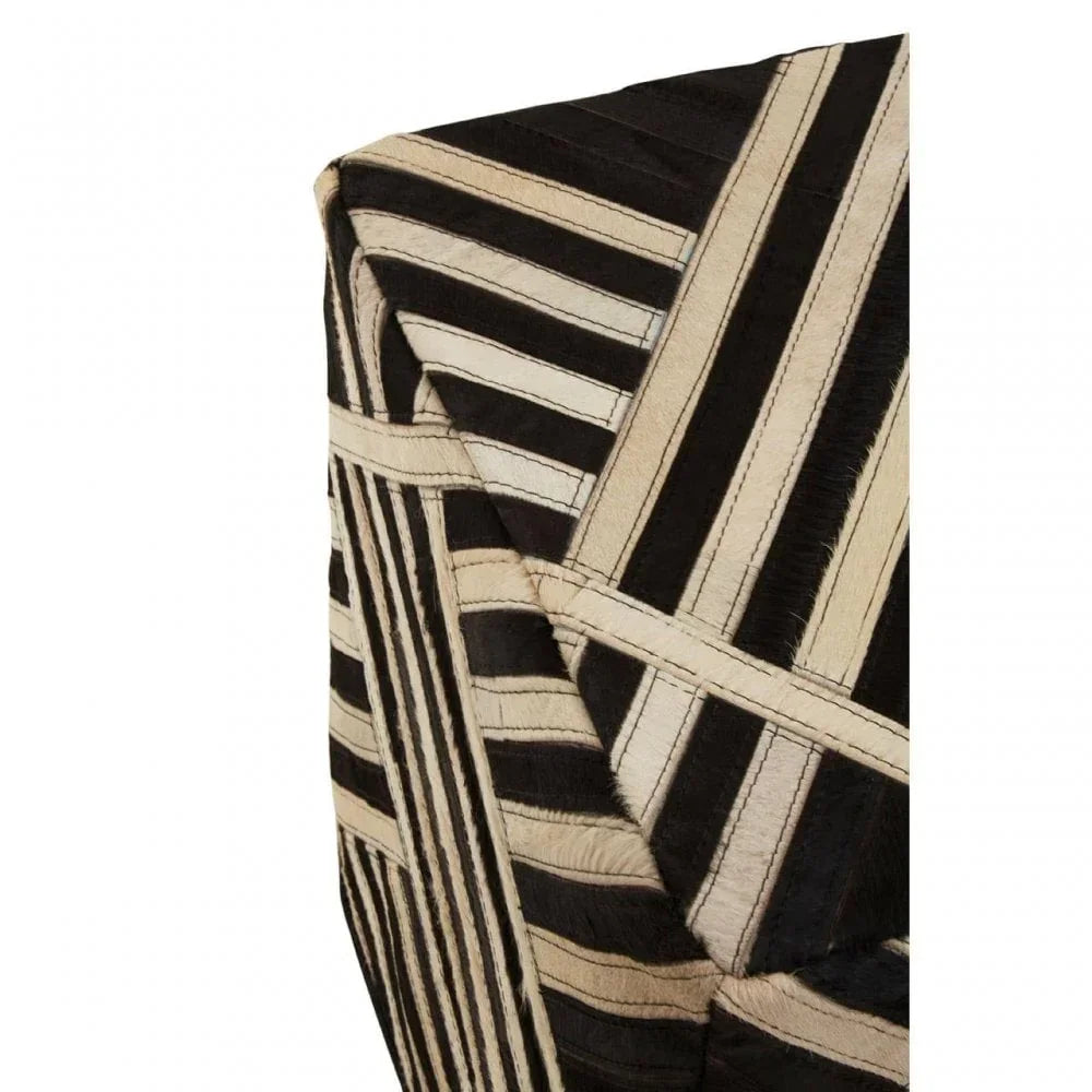 Geometric black and cream striped accent table corner with stitched pattern detail