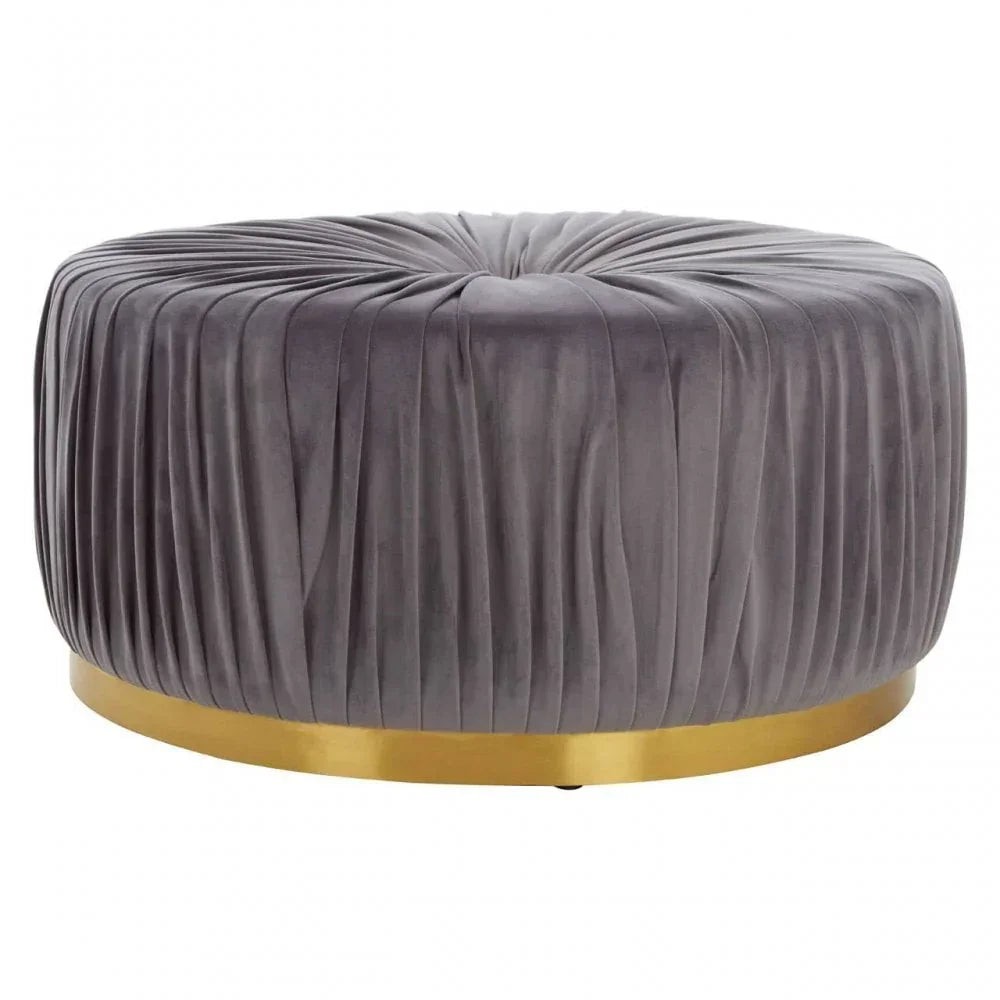 Round grey velvet ottoman with pleated detail and gold metal base