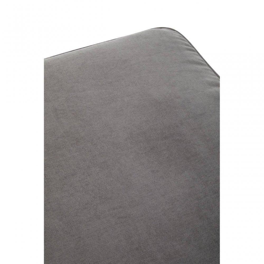 Close up of grey fabric cushion corner on sofa