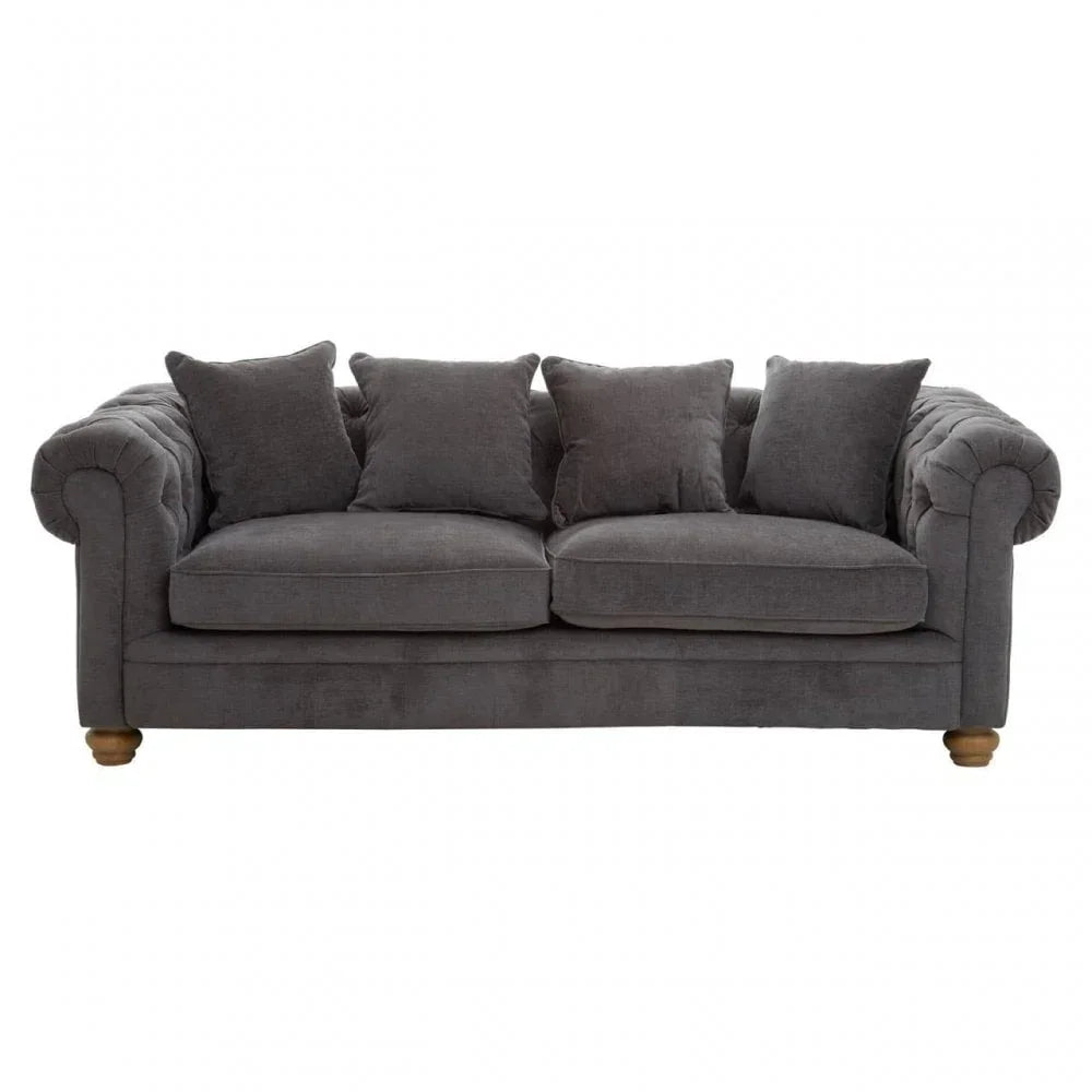 Dark grey fabric sofa with rolled arms and four matching scatter cushions, front view