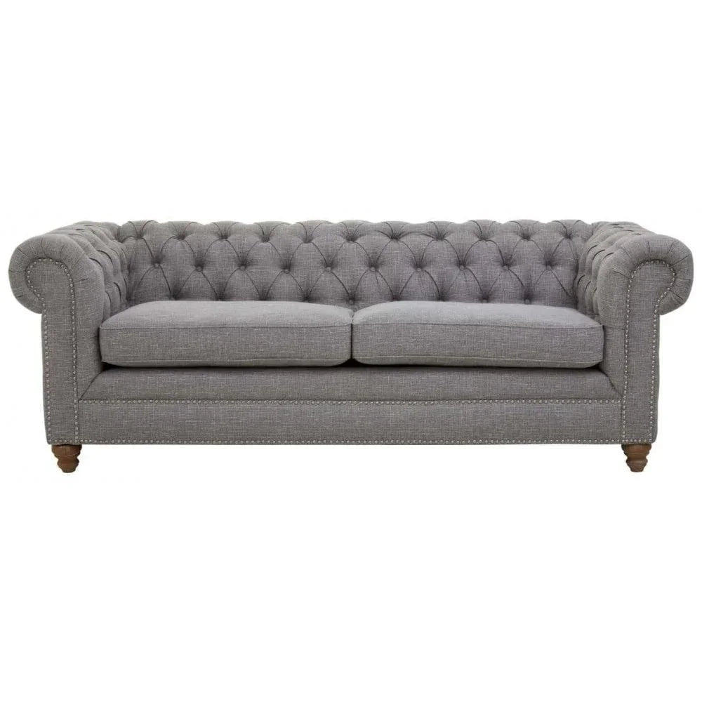 Grey fabric Chesterfield sofa with button-tufted back and rolled arms on wooden legs