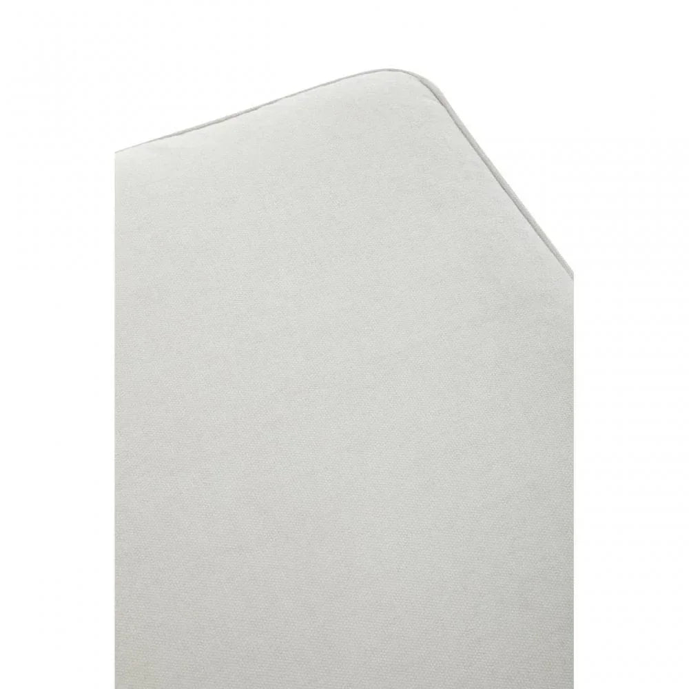 Close-up of light grey sofa cushion corner with soft fabric texture