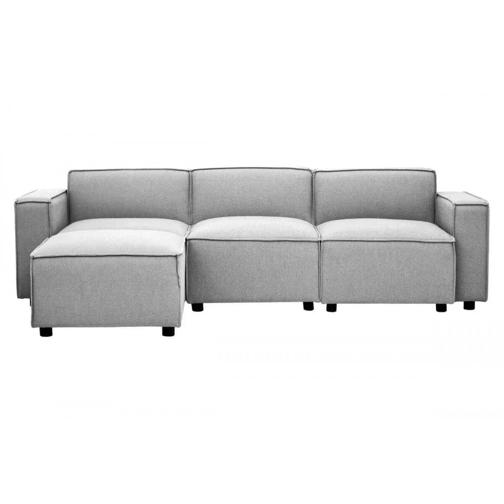 Light grey fabric corner sofa with chaise and wide armrests, front view