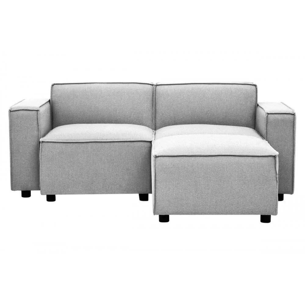 Light grey fabric corner sofa with wide arms and chaise section, front view