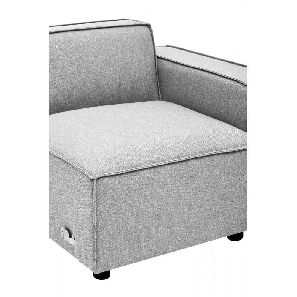 Light grey fabric armchair with wide armrests and metal handle on the side