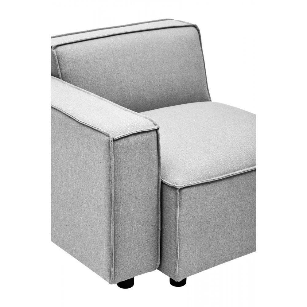 Light grey fabric armchair with boxy design and visible seams, front angle view