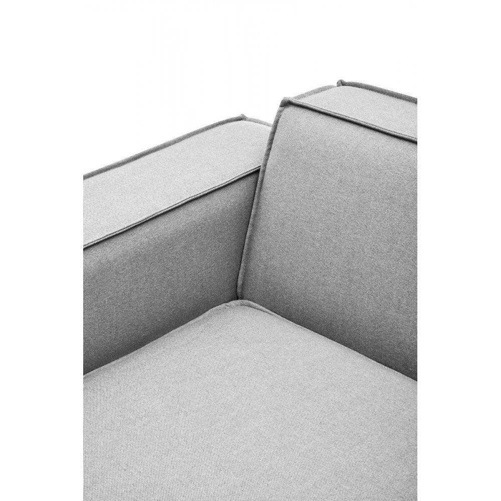 Close-up of light grey fabric sofa arm and backrest with piped edge detail