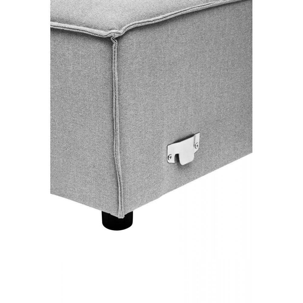 Closeup of grey fabric sofa corner with visible stitching and metal connector bracket