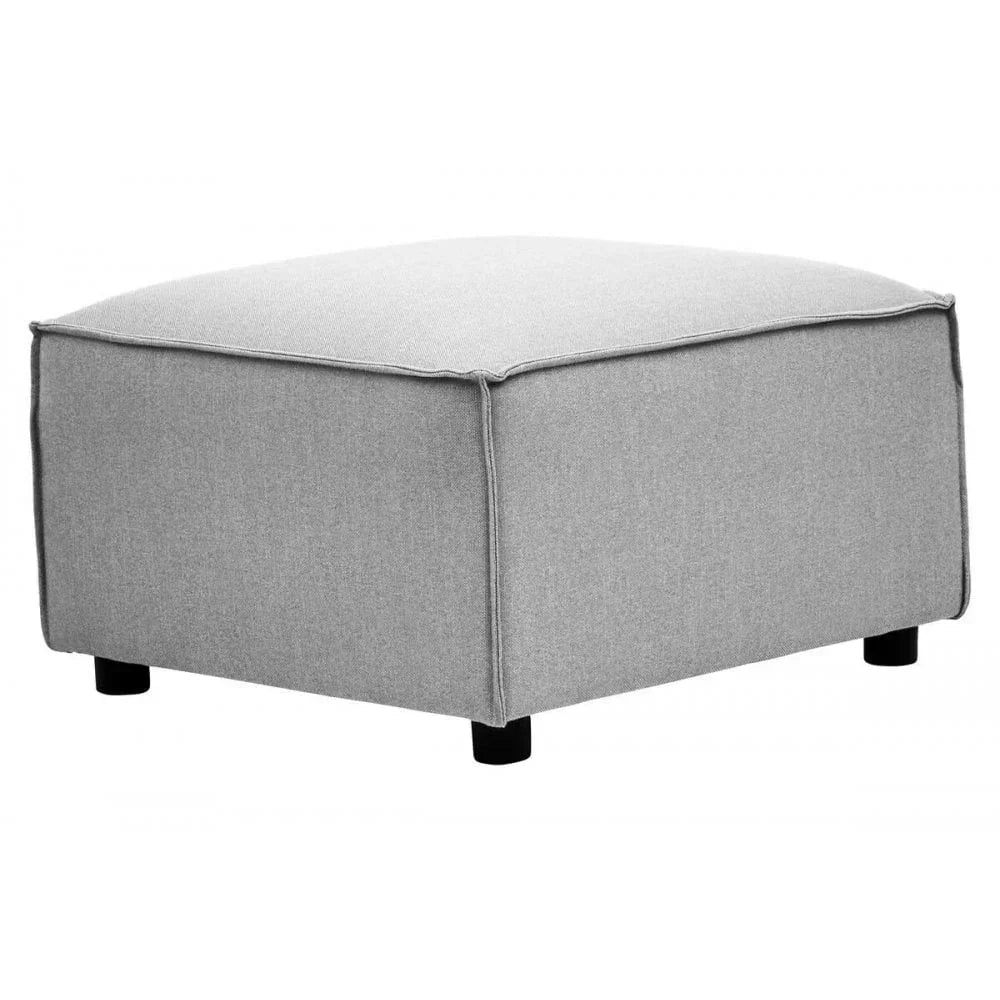 Light grey fabric ottoman with black legs, squared design, shown at an angle