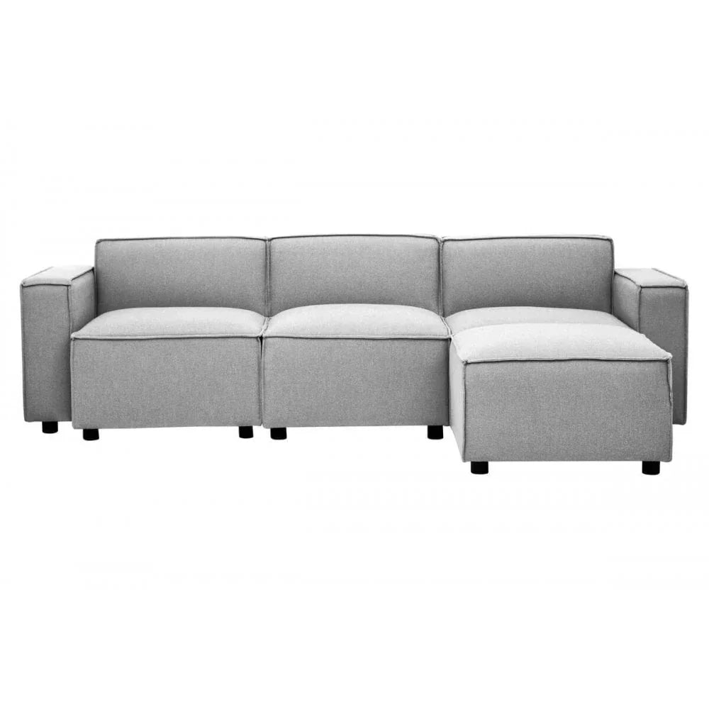 Light grey fabric corner sofa with square arms and chaise lounge section