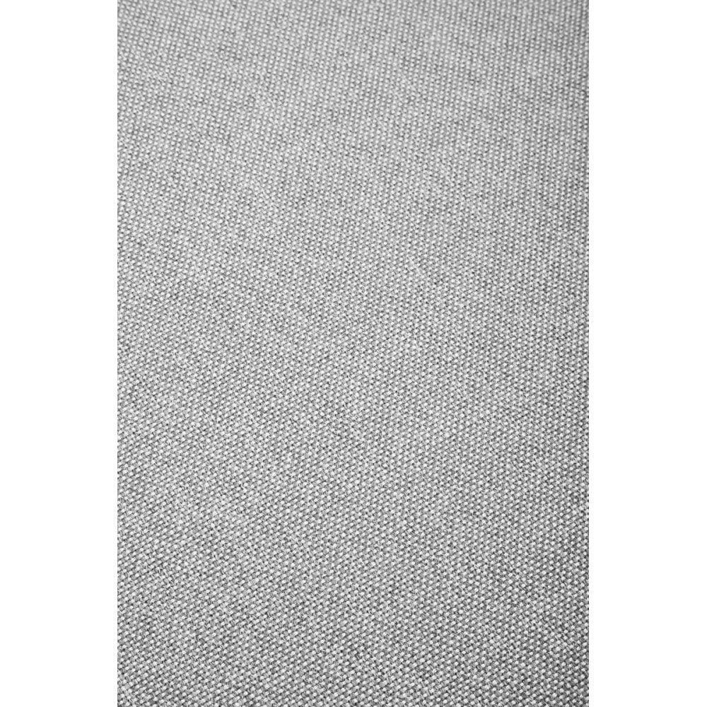 Close view of grey fabric upholstery with textured weave pattern for sofa or armchair