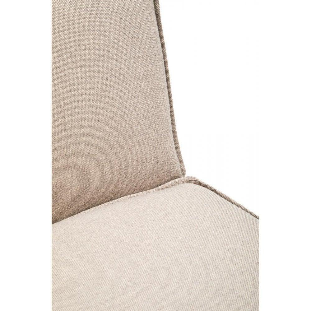 Close up of beige fabric armchair seat and backrest with visible stitching detail