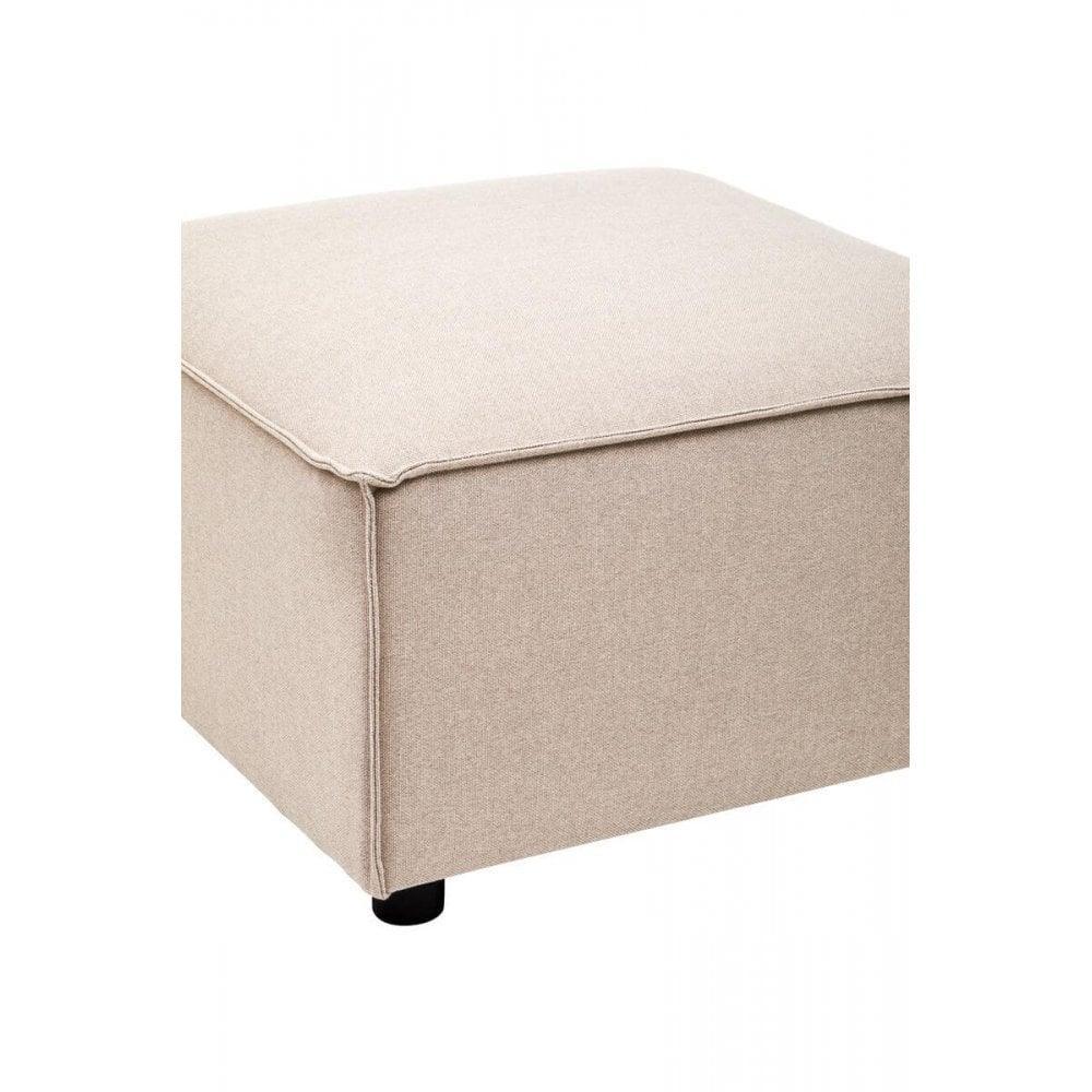 Beige fabric ottoman footstool with square shape and visible stitching on corner