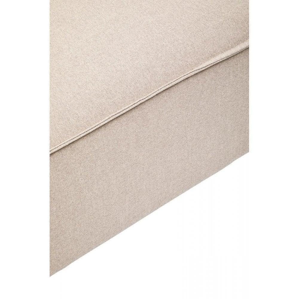 Beige fabric sofa corner with visible stitching detail
