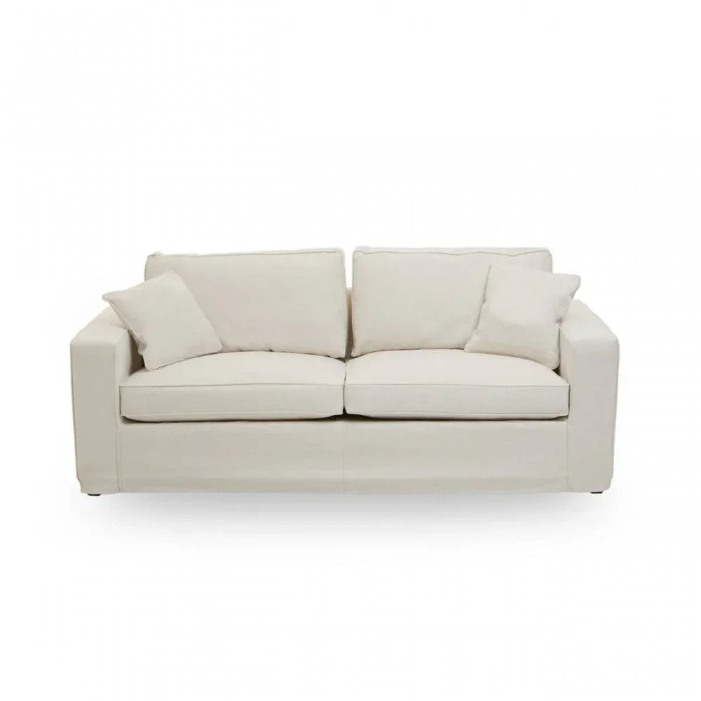 Three seater cream fabric sofa with square arms and four matching cushions, front view
