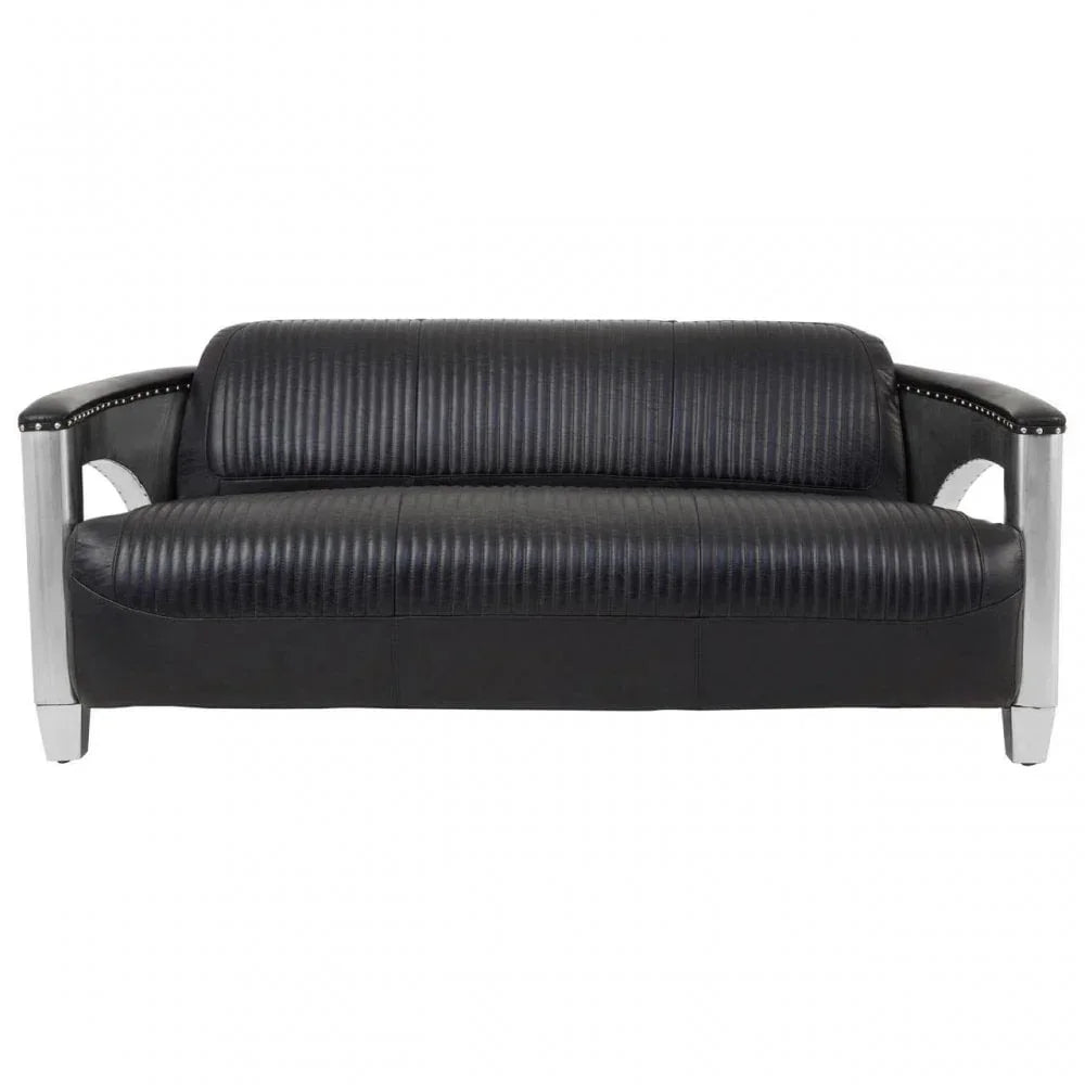 Black leather sofa with ribbed upholstery and chrome metal armrests, front view