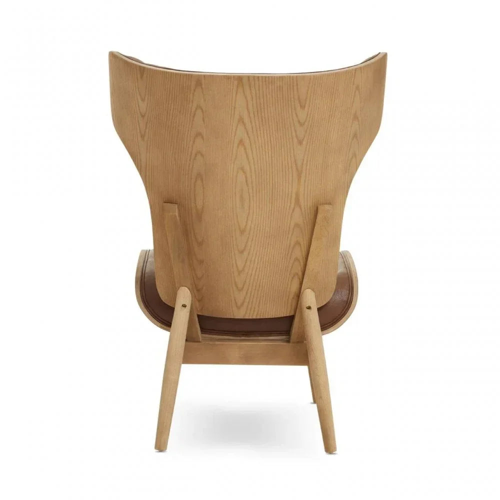 Curved wooden accent chair with angled legs and visible wood grain, rear view