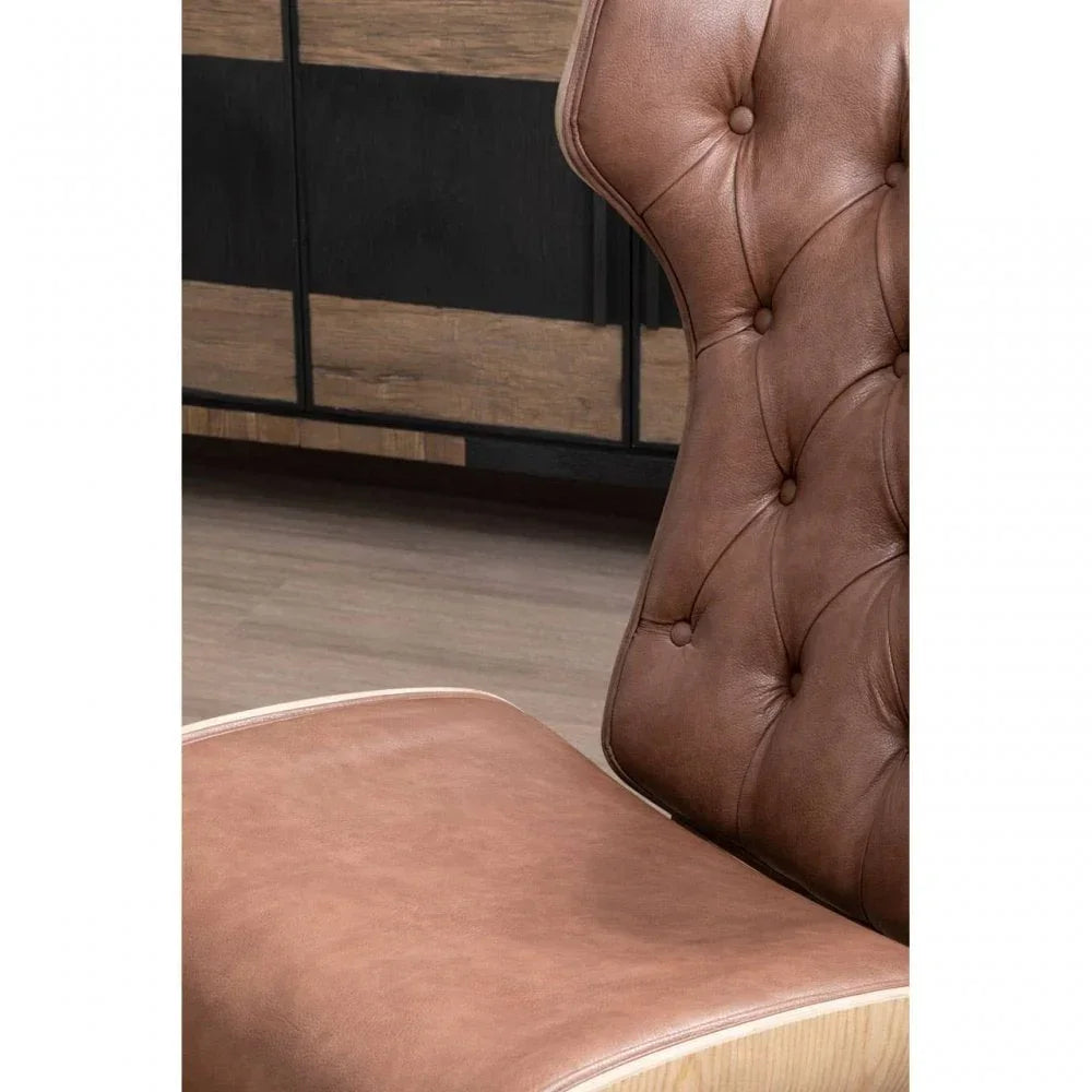 Close up of brown leather chair seat and tufted backrest with wood frame