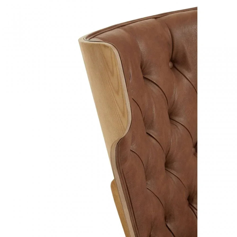 Brown leather chair with tufted backrest and light wood frame, close-up view