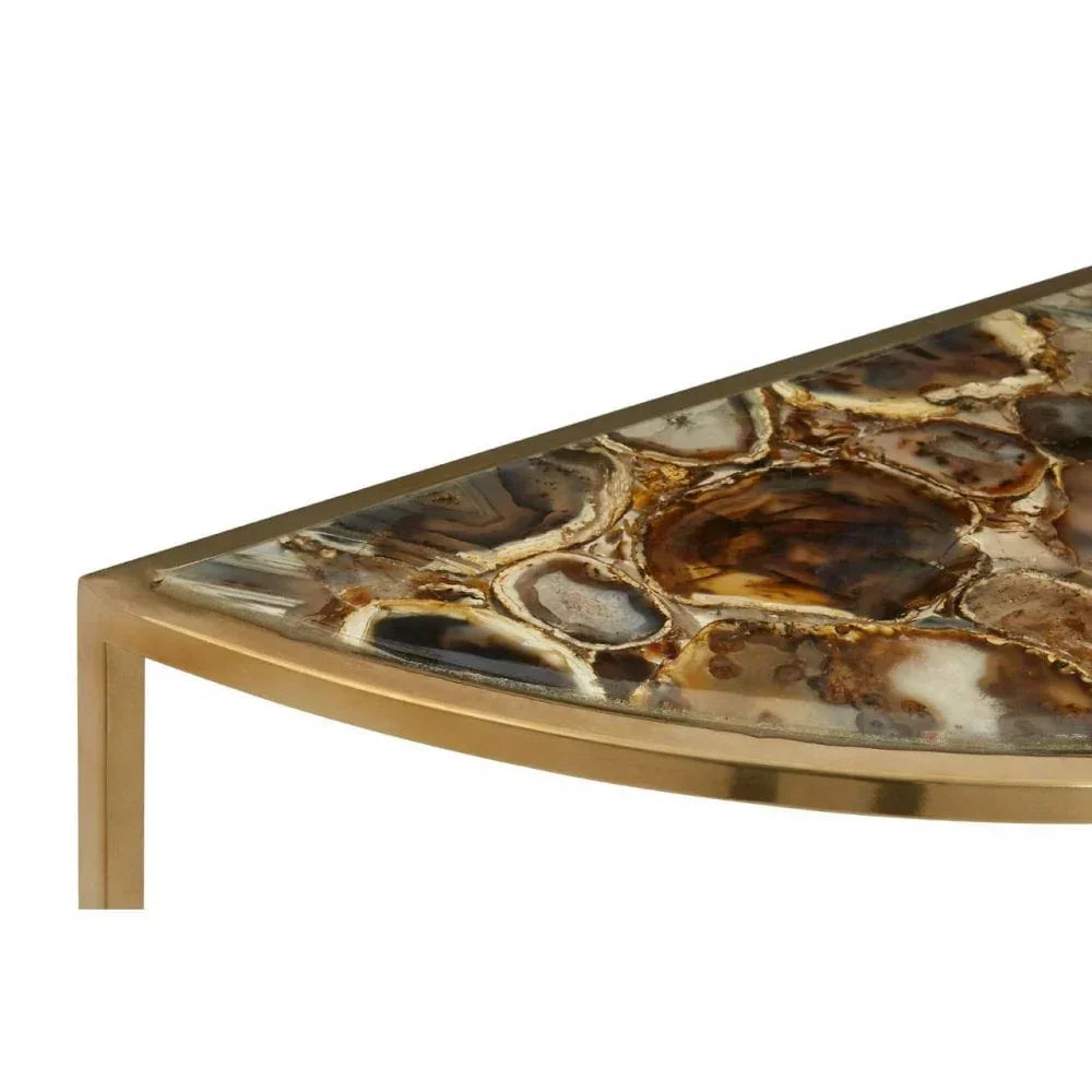 Close view of stone top side table with gold metal frame and polished agate surface