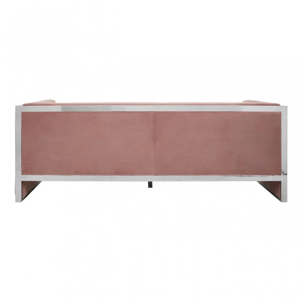 Rear view of pink velvet sofa with metal frame and clean lines