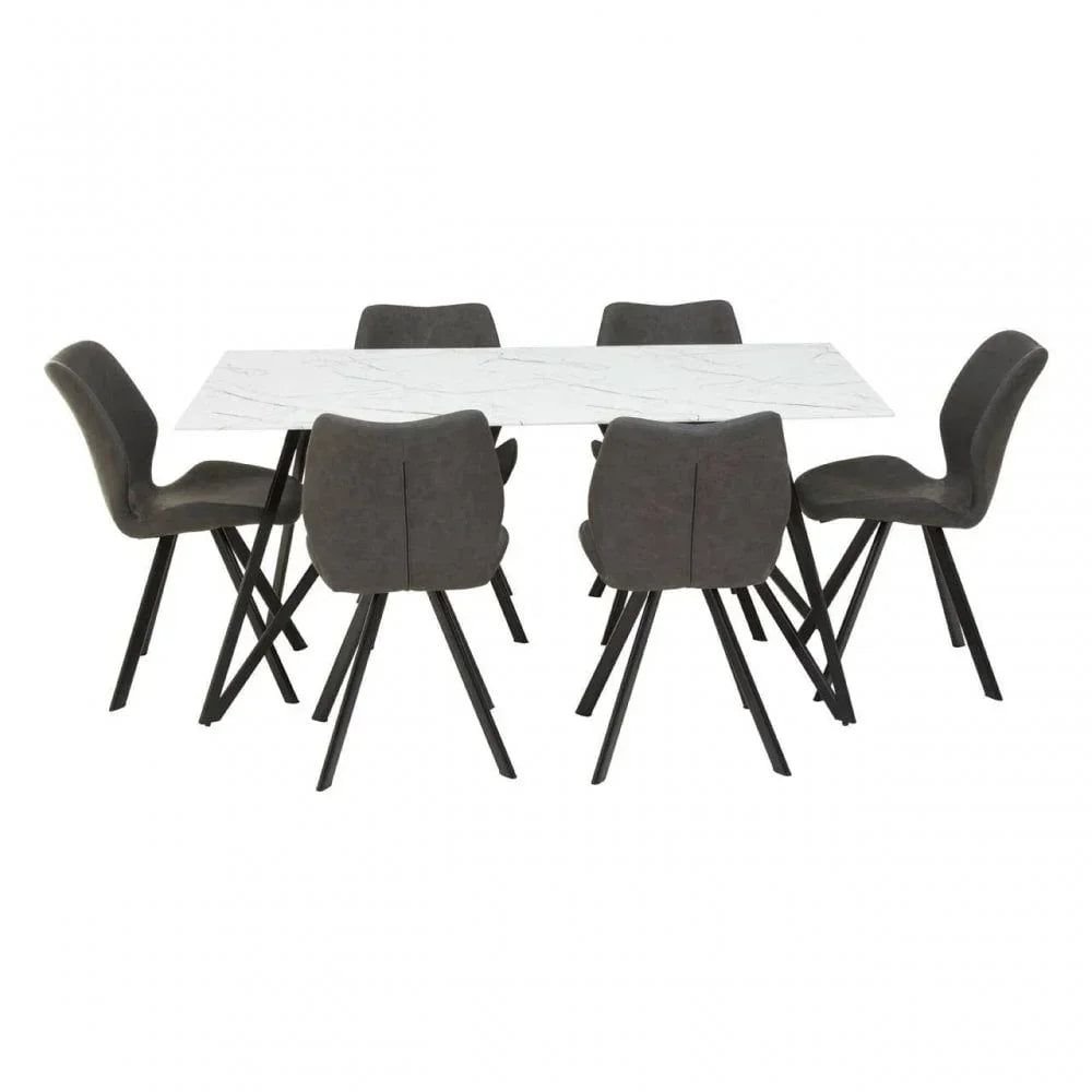 Modern marble dining table with six grey upholstered chairs and black metal legs